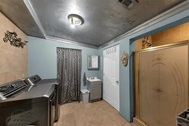 a dining room with stainless steel appliances kitchen island granite countertop a refrigerator and a stove top oven