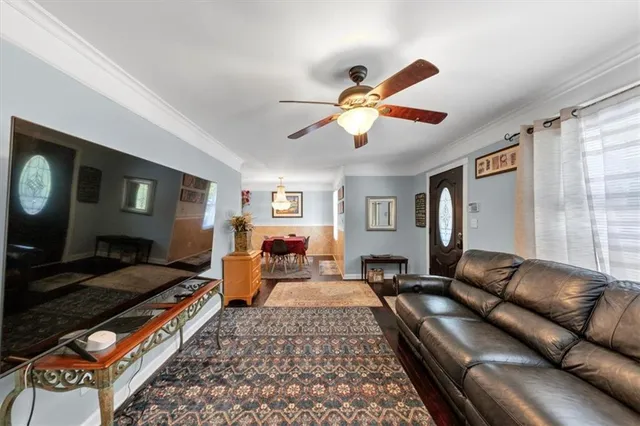 a large bedroom with a bed couch and a window