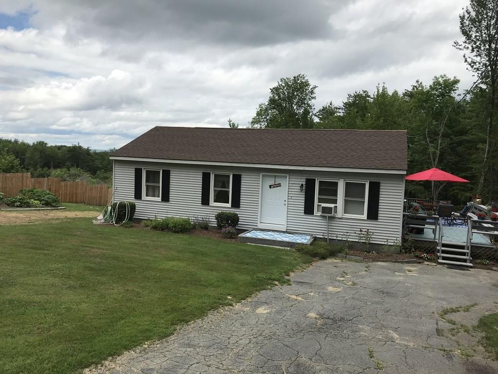 8 Dolbier Hill Road Templeton, MA 01468 - Photo 1 of 15 a front view of a house with a garden