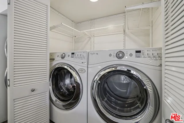 a view of washer and dryer in a utility room