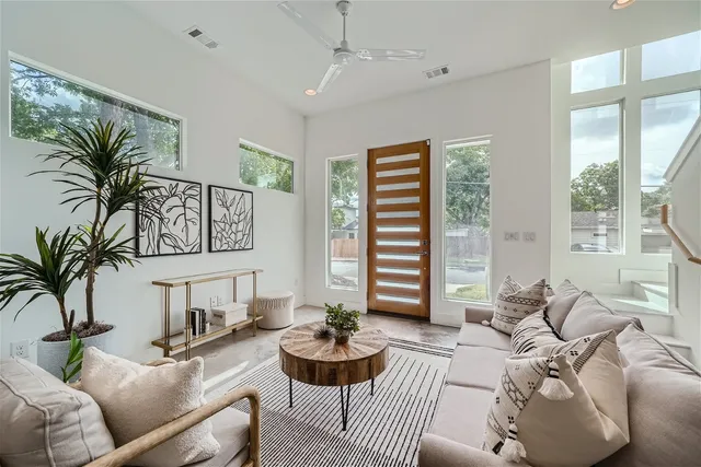 a living room with furniture and a large window