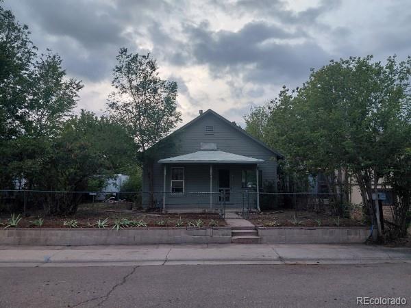 1917 South Fox Street Denver, CO 80223 - Photo 1 of 10 a front view of a house with a garden
