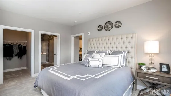 a bedroom with a bed and a table in it