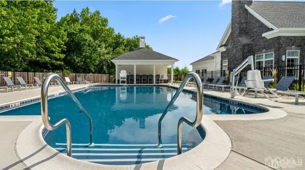 a view of a swimming pool with a patio