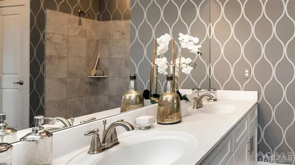 a bathroom with a sink and a mirror