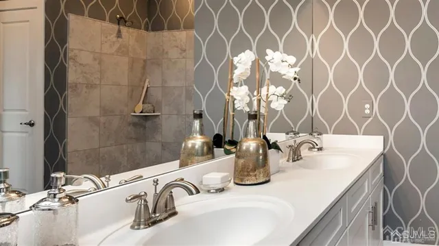 a bathroom with a sink and a mirror