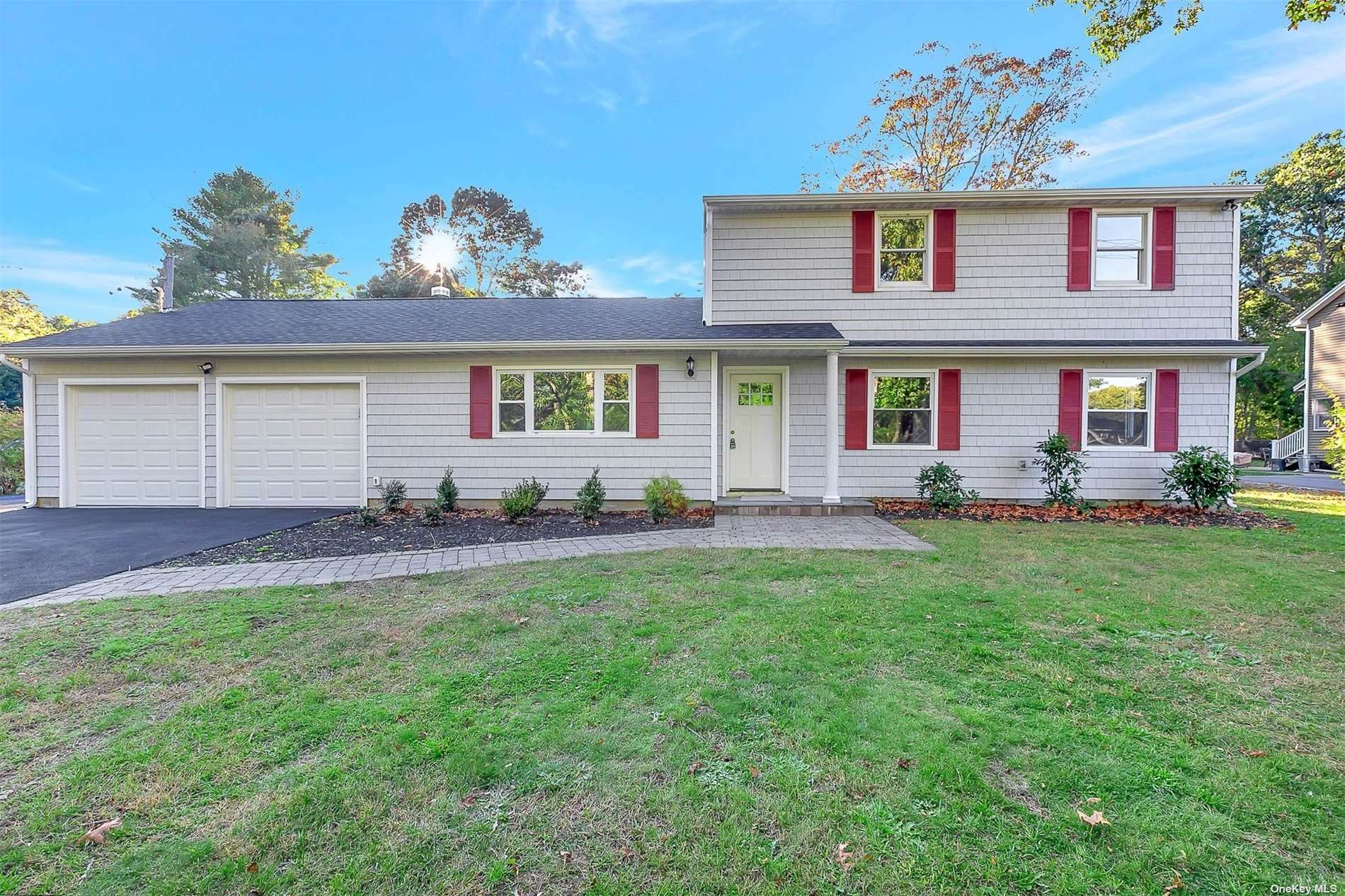 a front view of house with yard and outdoor seating