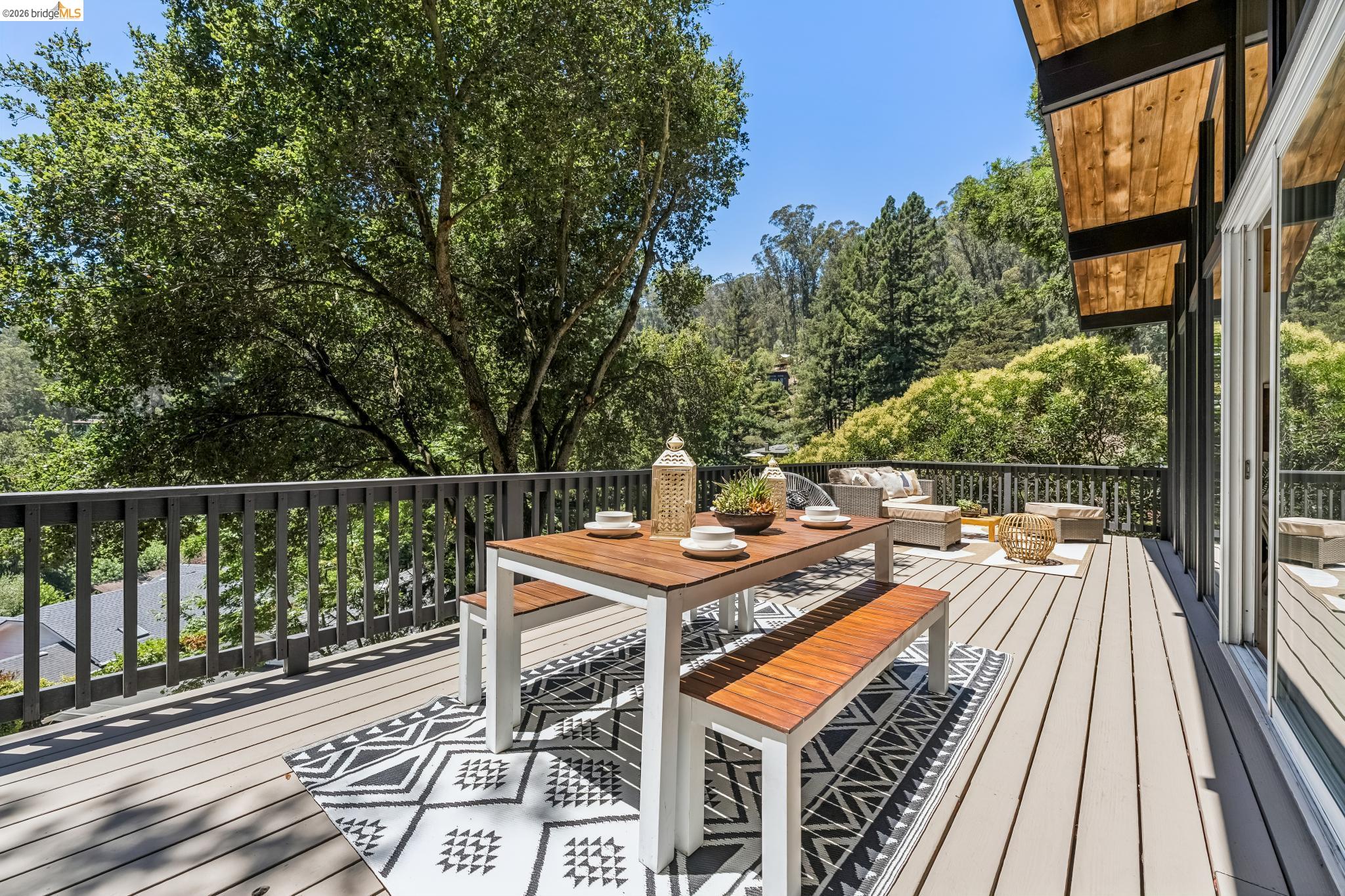 6645 Heather Ridge Way Oakland, CA 94611 - Photo 42 of 61 Expansive outdoor deck featuring wood-finish flooring and black railings