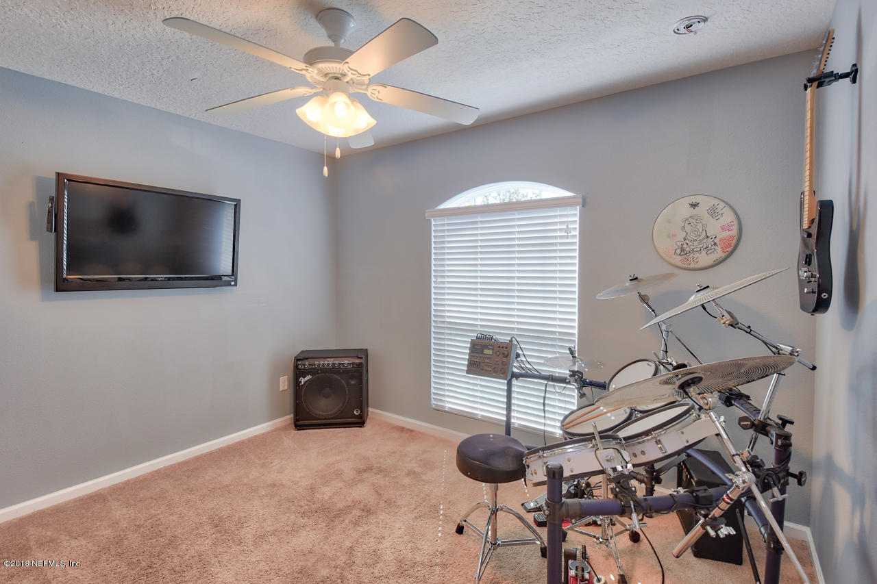 26 North Twin Maple Road St. Augustine, FL 32084 - Photo 19 of 26 a view of a livingroom with furniture and a flat screen tv