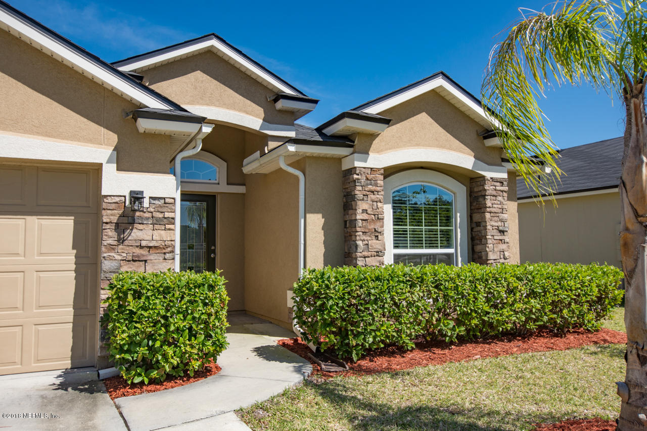 26 North Twin Maple Road St. Augustine, FL 32084 - Photo 4 of 26 a view of a house with potted plants