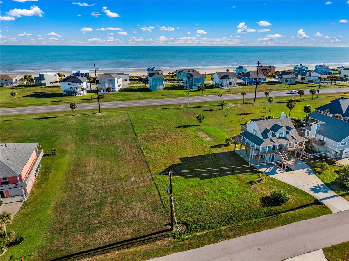 18703 Shaman Road Galveston, TX 77554 - Photo 6 of 20 a view of a golf course with a swimming pool
