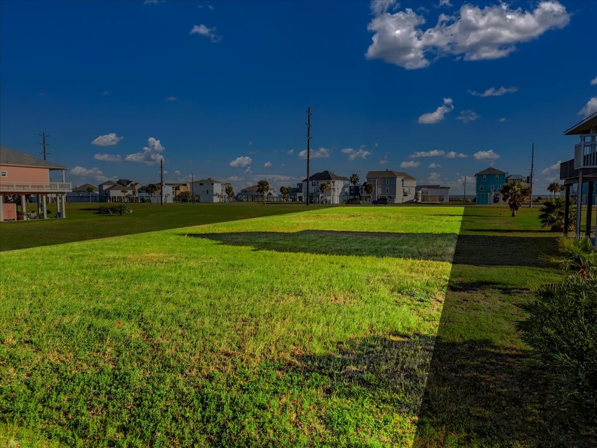 18703 Shaman Road Galveston, TX 77554 - Photo 10 of 20 a view of a house with a big yard