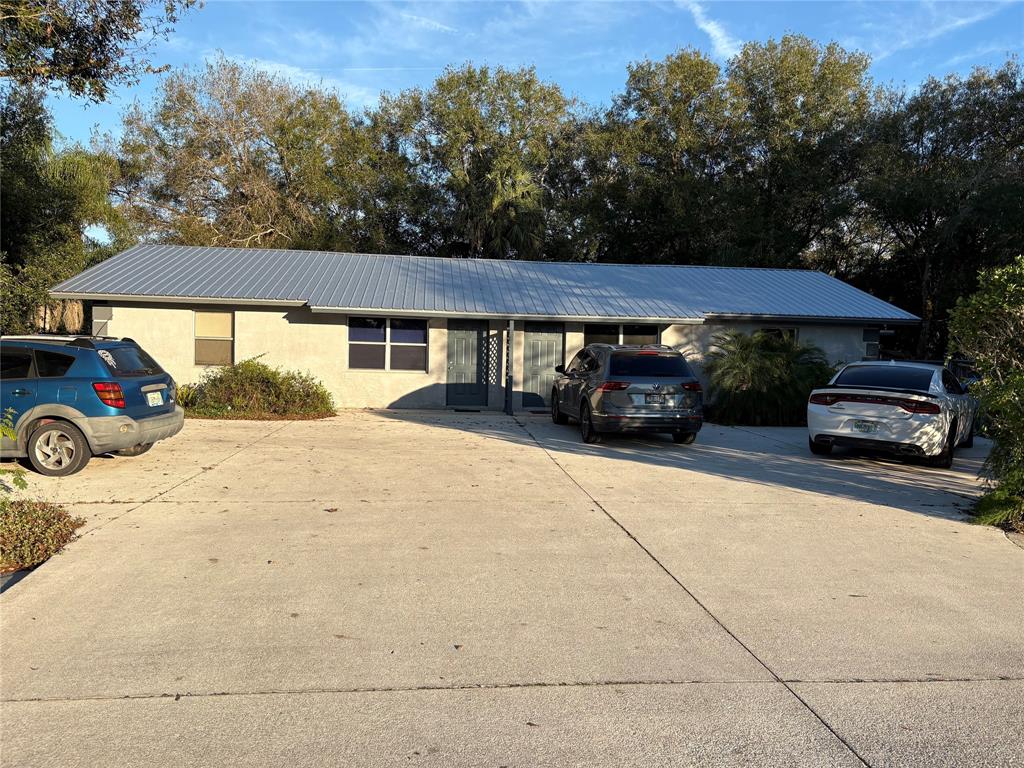 540 Northwest 24th Avenue Okeechobee, FL 34972 - Photo 1 of 24 a car parked in front of a house