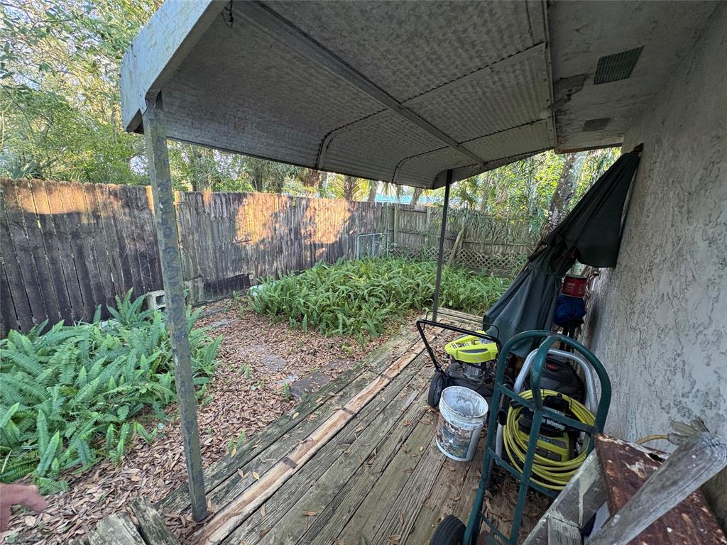 540 Northwest 24th Avenue Okeechobee, FL 34972 - Photo 20 of 24 a view of an chair and table in the garden