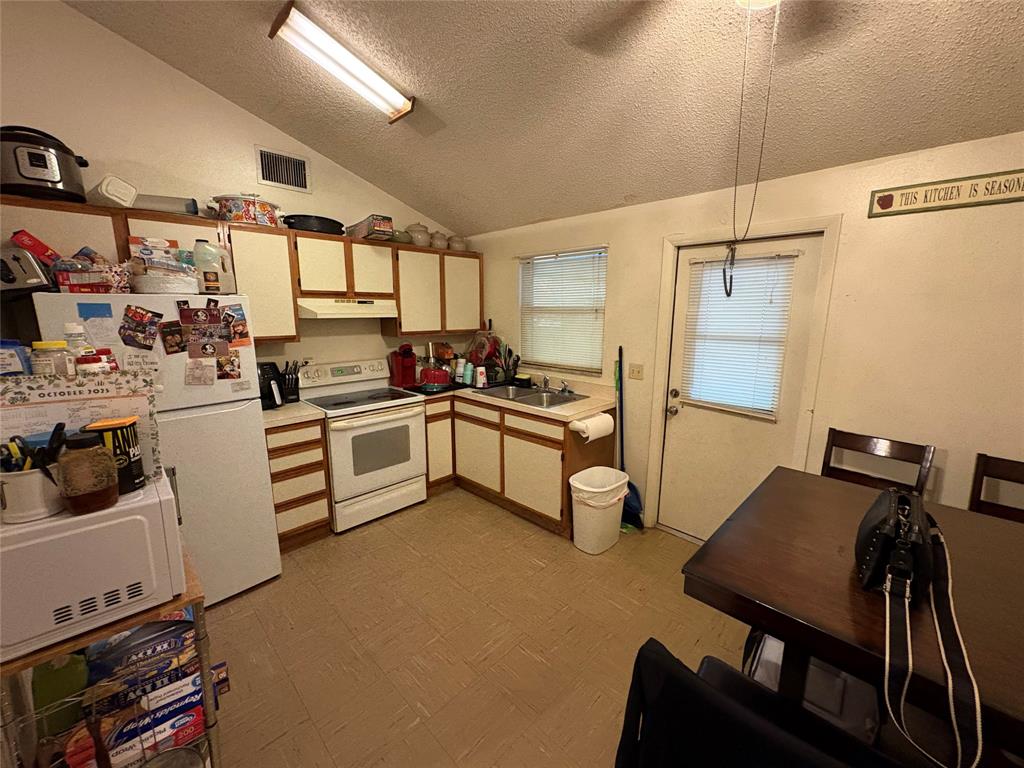 540 Northwest 24th Avenue Okeechobee, FL 34972 - Photo 8 of 24 a kitchen with a sink appliances and cabinets