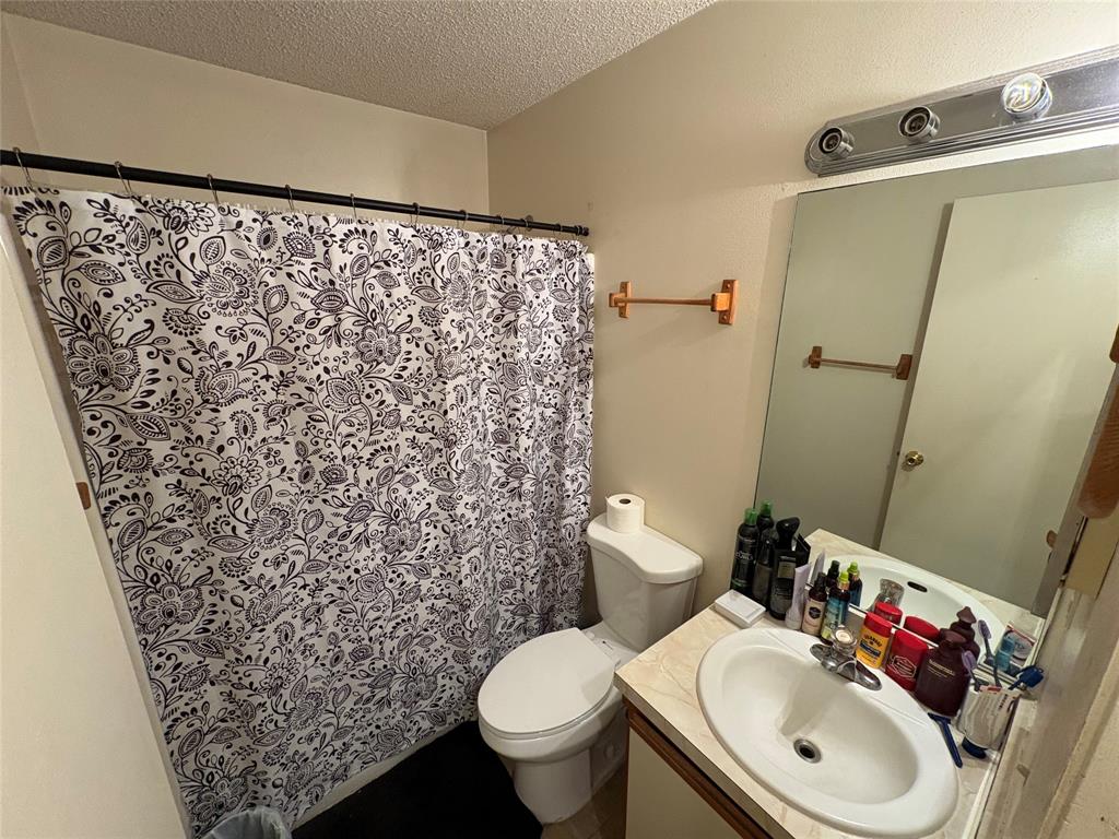 540 Northwest 24th Avenue Okeechobee, FL 34972 - Photo 9 of 24 a bathroom with a sink toilet and a mirror