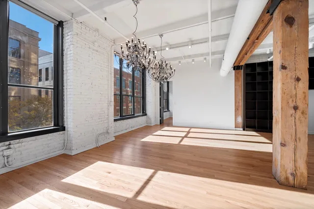a bedroom with a bed and a flat tv screen