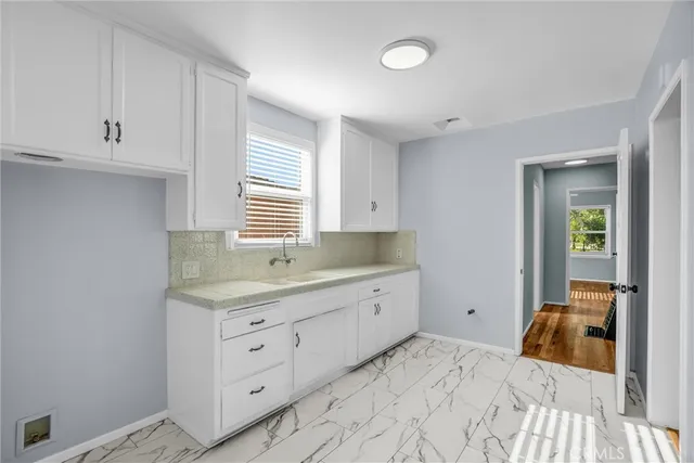 a bedroom with a bad and dresser