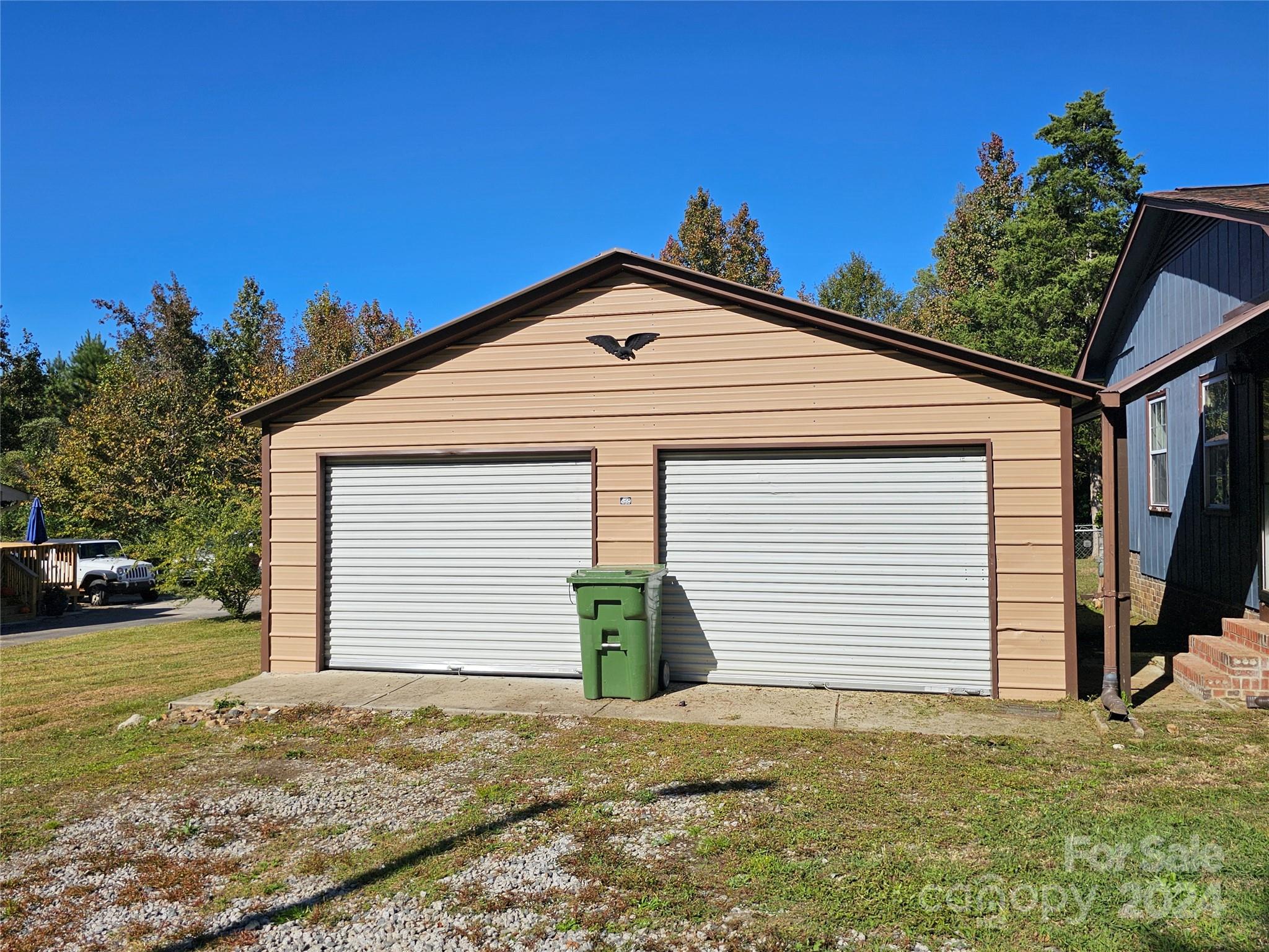 2702 University Drive Lancaster, SC 29720 - Photo 4 of 17 a view of a white house with a yard and garage