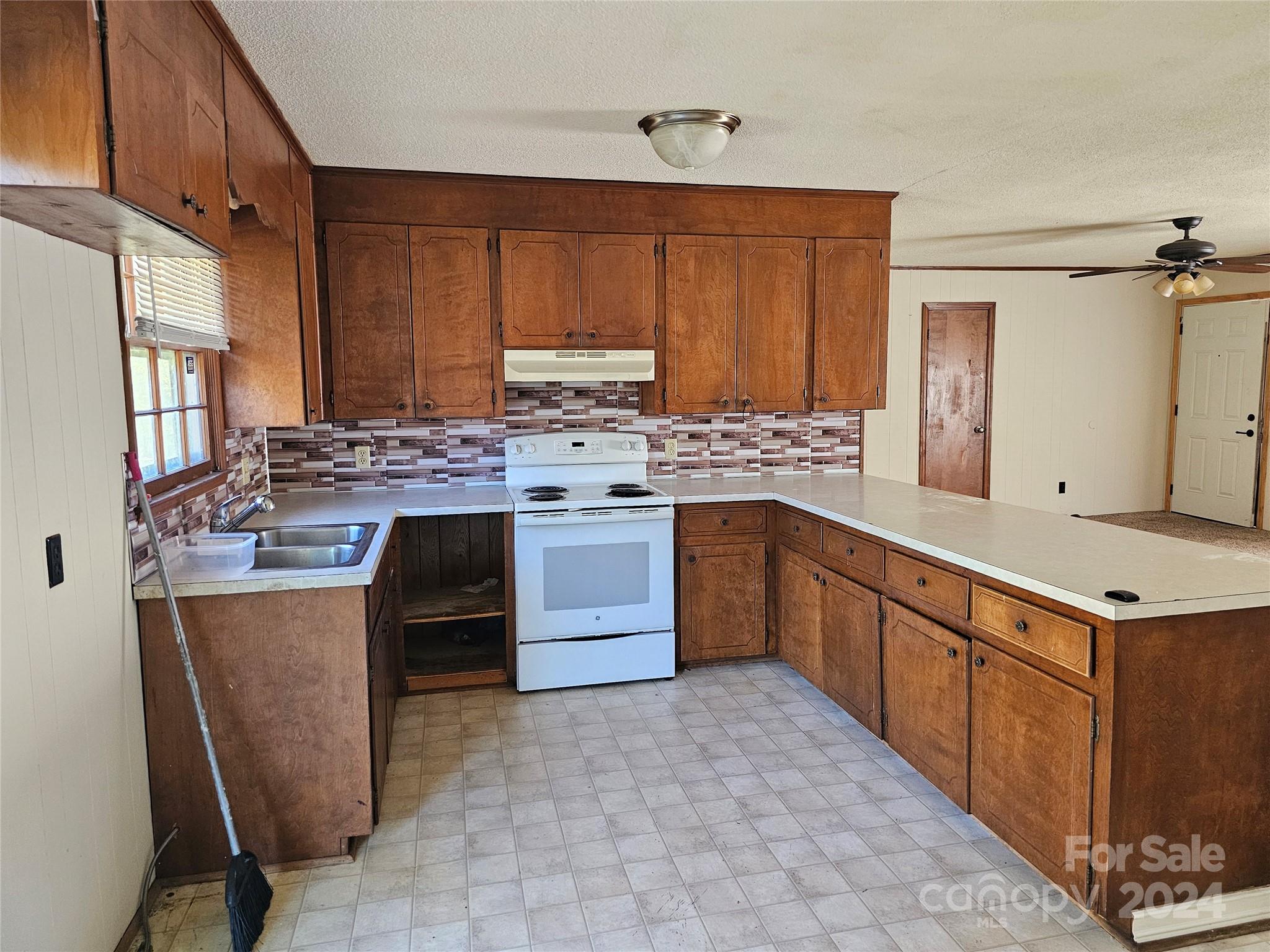 2702 University Drive Lancaster, SC 29720 - Photo 8 of 17 a kitchen with stainless steel appliances granite countertop a stove oven and sink