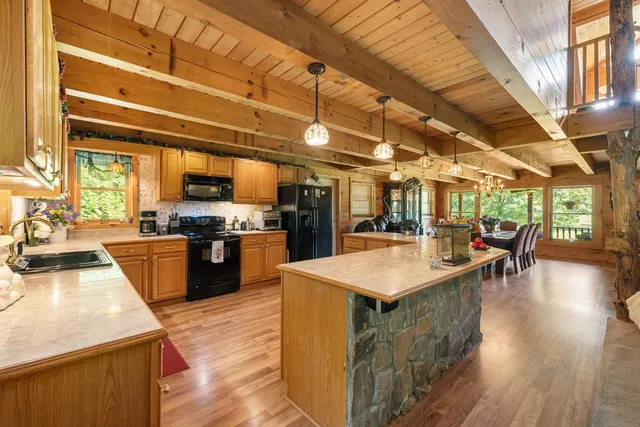 a kitchen with lots of counter top space and stainless steel appliances