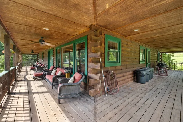 a sitting area with furniture and wooden floor