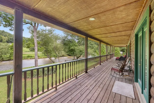 a view of balcony with wooden floor
