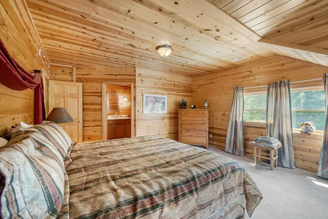 a bedroom with a large bed and a large closet