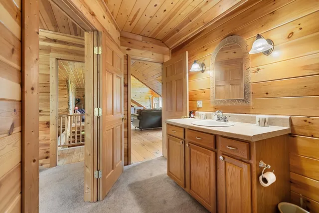 a bathroom with a sink and mirror