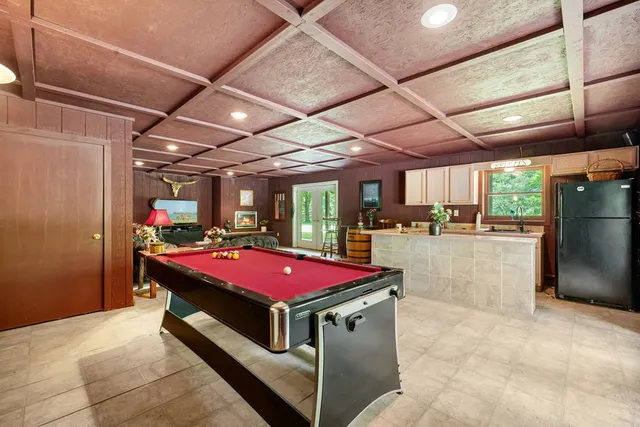 a bathroom with a double vanity sink toilet and shower