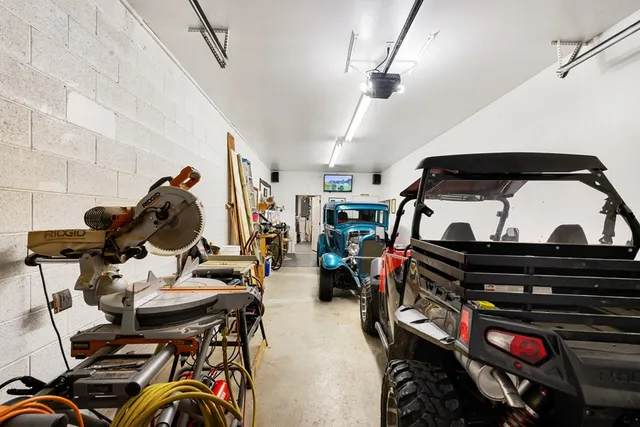 a spacious bedroom with a bed and a table