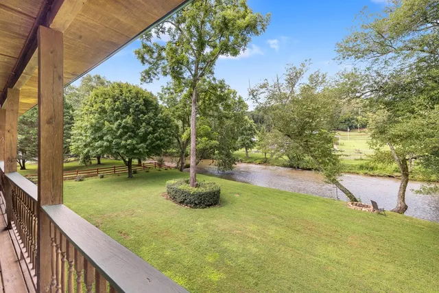 a view of a swimming pool with a patio