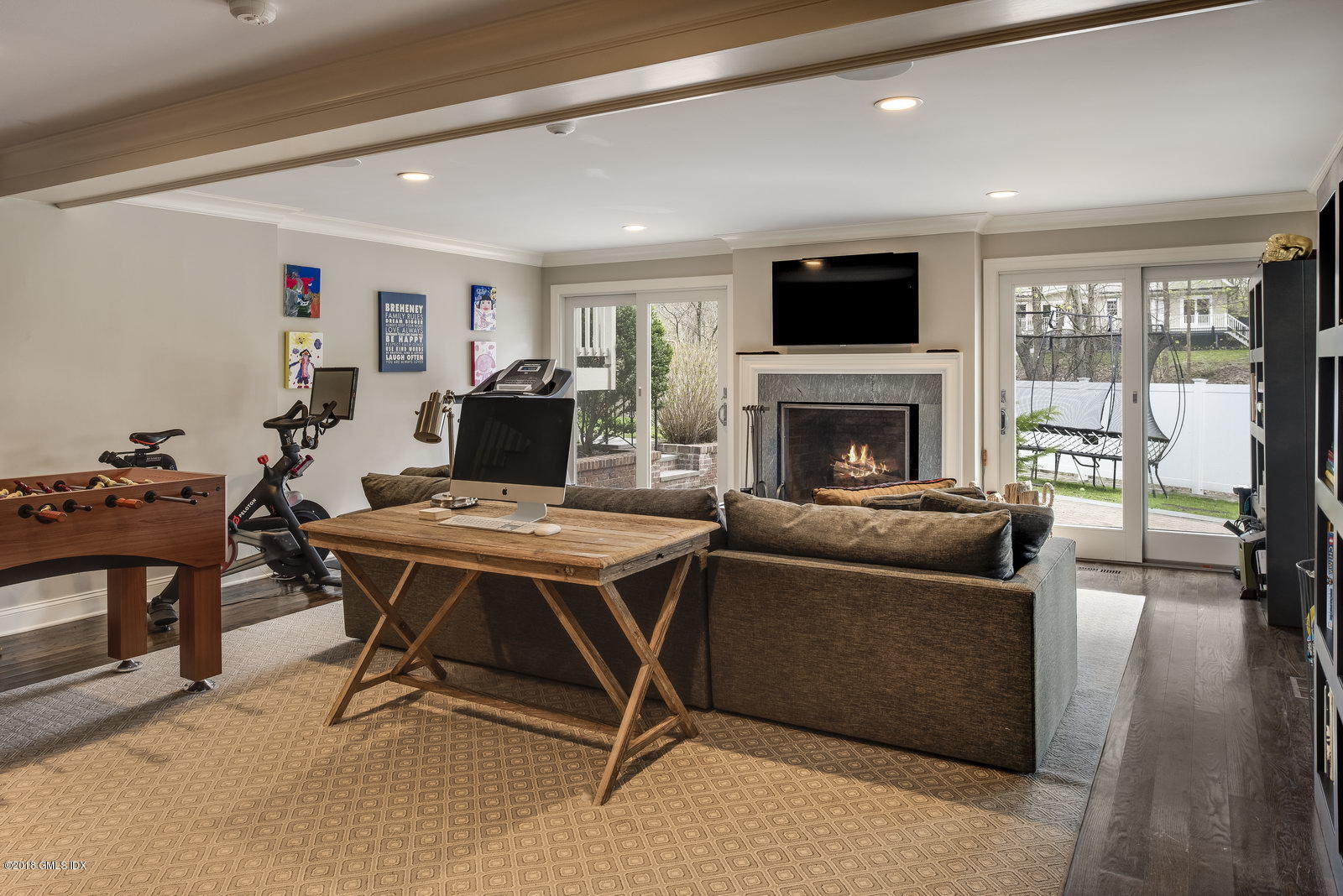 341 Stanwich Road Greenwich, CT 06830 - Photo 11 of 18 a living room with furniture a flat screen tv and a fireplace