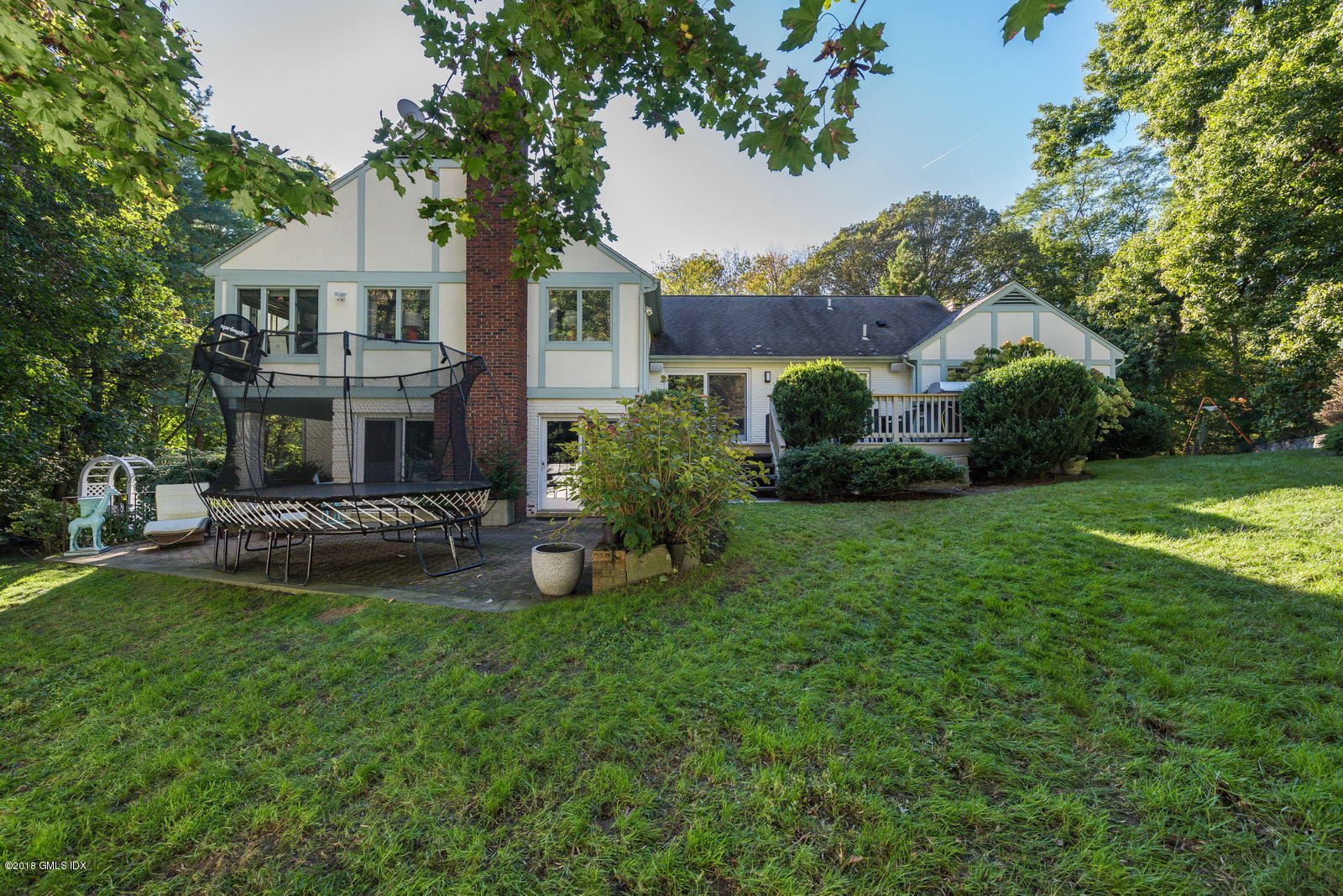 341 Stanwich Road Greenwich, CT 06830 - Photo 17 of 18 a view of a house with a yard porch and sitting area