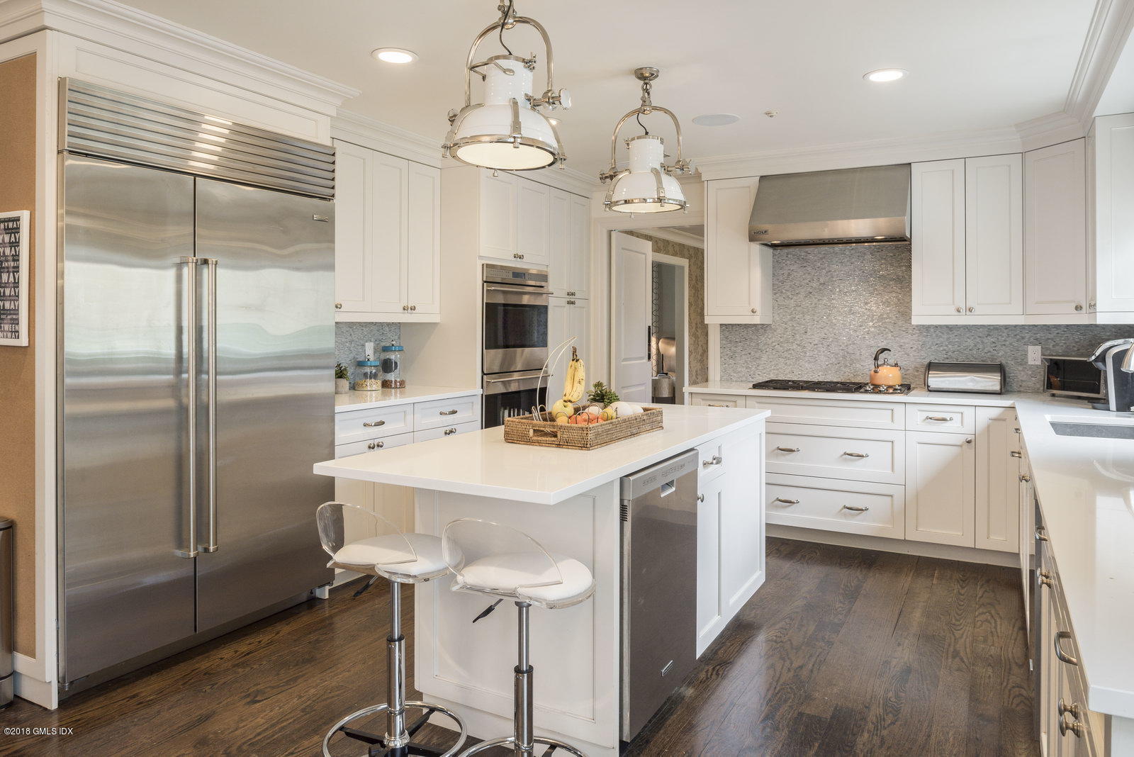 341 Stanwich Road Greenwich, CT 06830 - Photo 2 of 18 a kitchen with a refrigerator a sink and cabinets