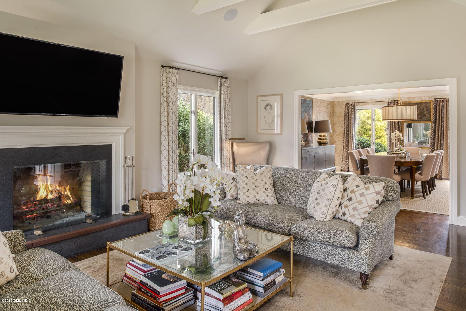 341 Stanwich Road Greenwich, CT 06830 - Photo 5 of 18 a living room with furniture a flat screen tv and a fireplace