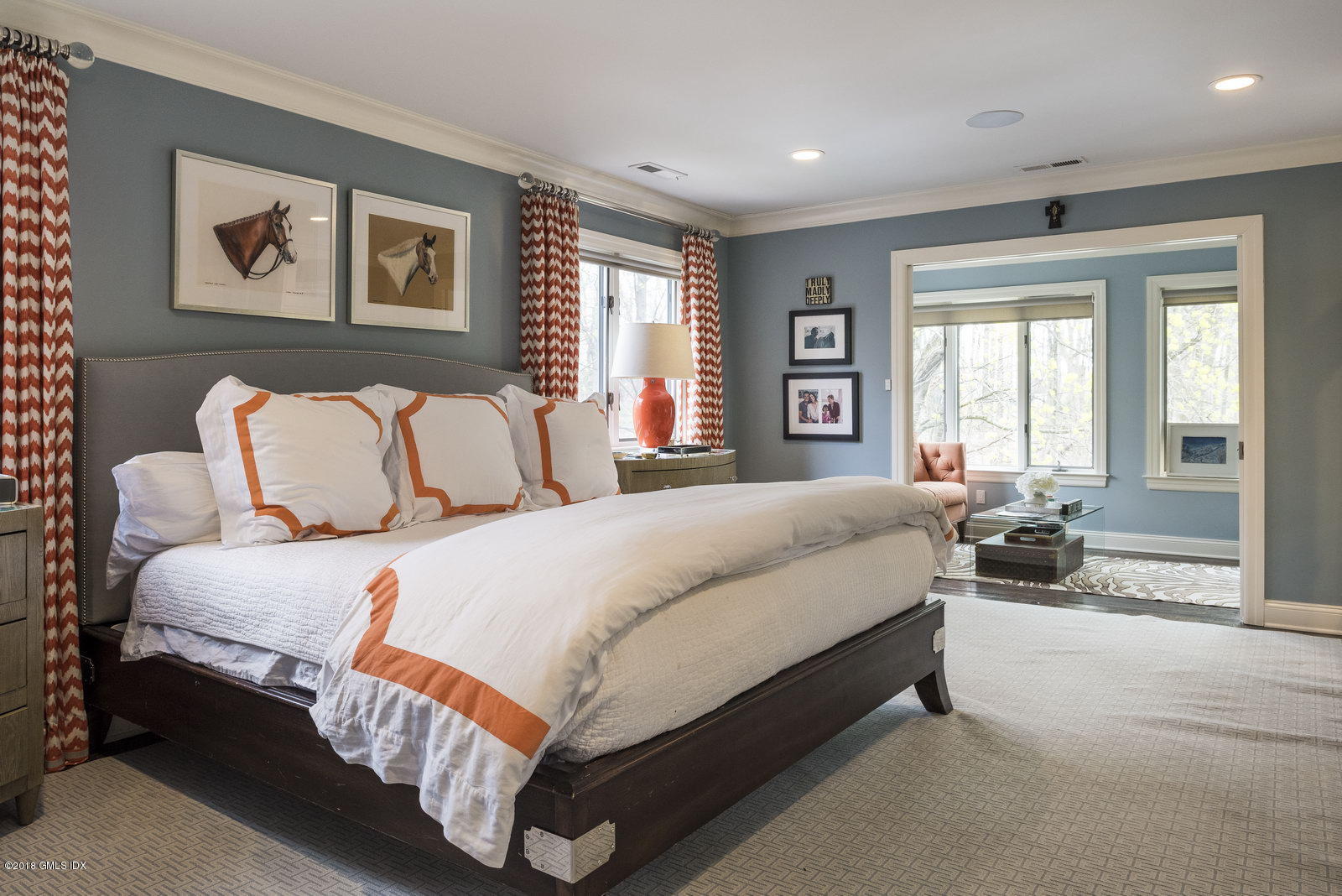 341 Stanwich Road Greenwich, CT 06830 - Photo 6 of 18 a spacious bedroom with a bed and glass windows