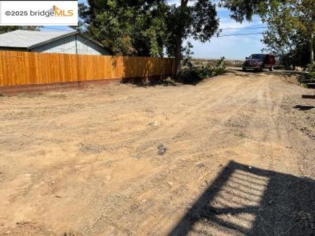1472 Taylor Road Bethel Island, CA 94511 - Photo 3 of 12 a view of wooden fence and trees