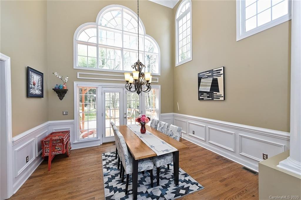 3330 Rhett Butler Place Charlotte, NC 28270 - Photo 12 of 48 a living room with furniture a fireplace and a table