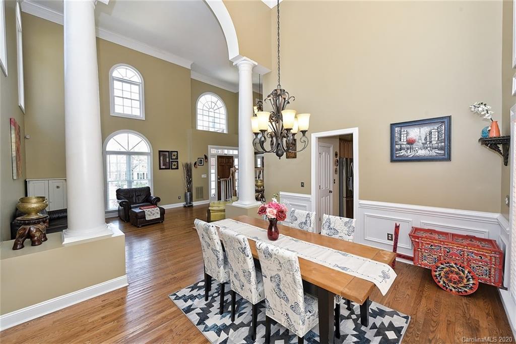 3330 Rhett Butler Place Charlotte, NC 28270 - Photo 13 of 48 a view of a dining room with furniture and wooden floor