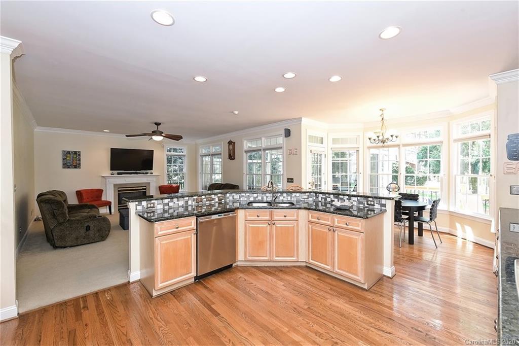 3330 Rhett Butler Place Charlotte, NC 28270 - Photo 20 of 48 a kitchen with stainless steel appliances granite countertop a stove and cabinets