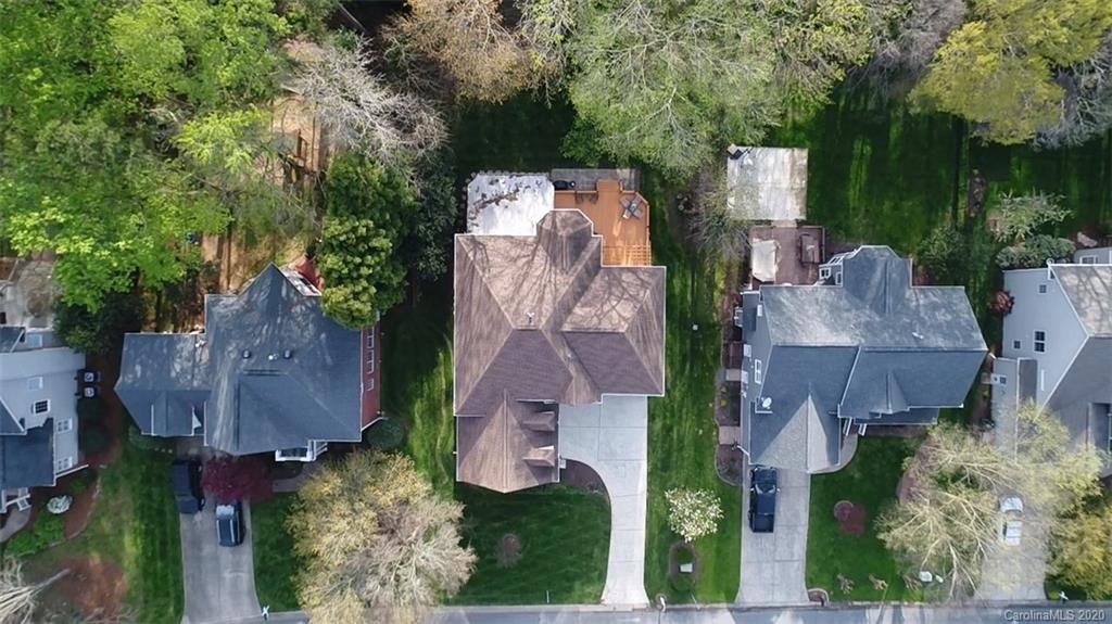 3330 Rhett Butler Place Charlotte, NC 28270 - Photo 3 of 48 an aerial view of a house with outdoor space and a lake view