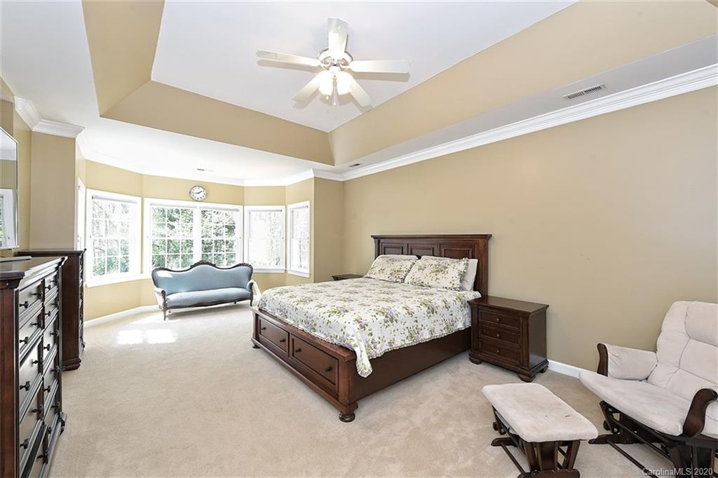 3330 Rhett Butler Place Charlotte, NC 28270 - Photo 26 of 48 a bedroom with a bed window and couch