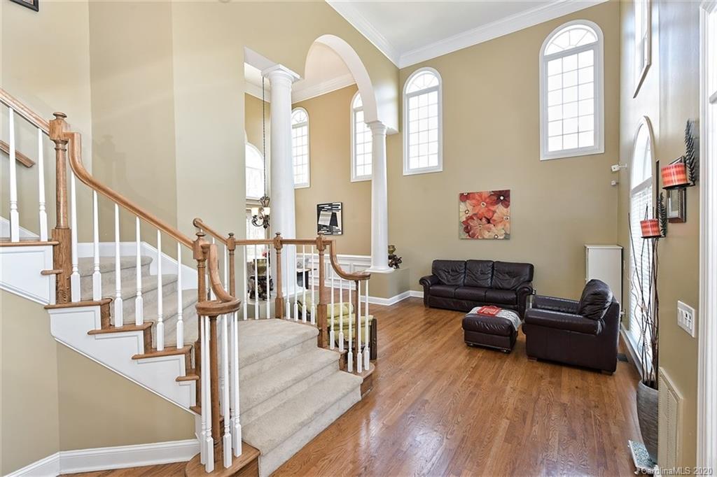 3330 Rhett Butler Place Charlotte, NC 28270 - Photo 4 of 48 a living room with furniture and a floor to ceiling window