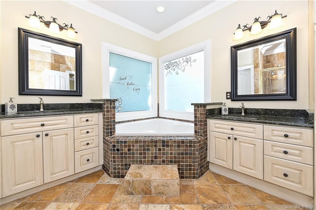3330 Rhett Butler Place Charlotte, NC 28270 - Photo 31 of 48 a bathroom with a granite countertop sink mirror and