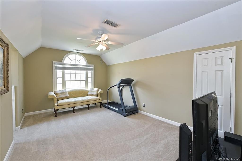 3330 Rhett Butler Place Charlotte, NC 28270 - Photo 36 of 48 a living room with furniture a chandelier and a window