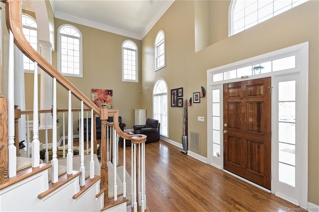 3330 Rhett Butler Place Charlotte, NC 28270 - Photo 5 of 48 a view of entryway with wooden floor and livingroom view