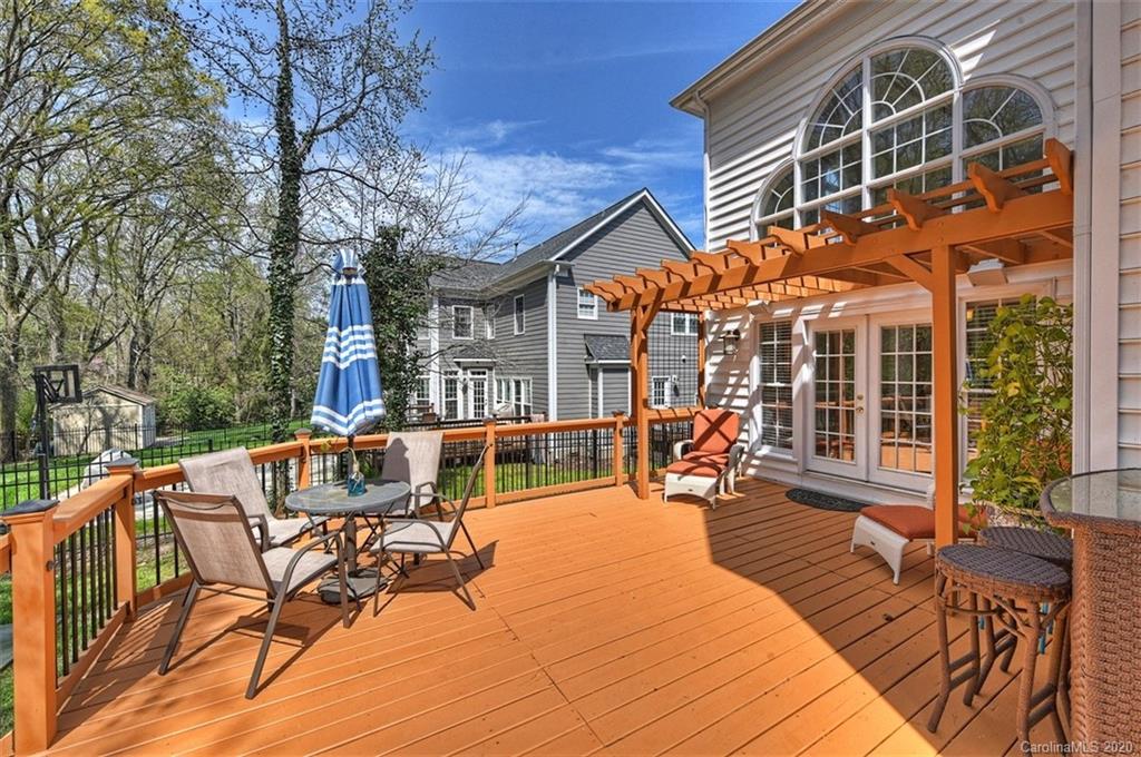 3330 Rhett Butler Place Charlotte, NC 28270 - Photo 42 of 48 a view of a patio with table and chairs near a barbeque