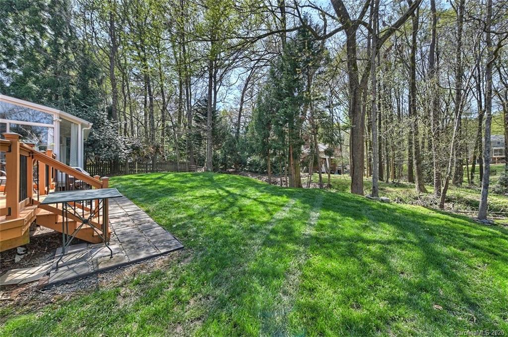 3330 Rhett Butler Place Charlotte, NC 28270 - Photo 44 of 48 a view of a house with backyard and a slide