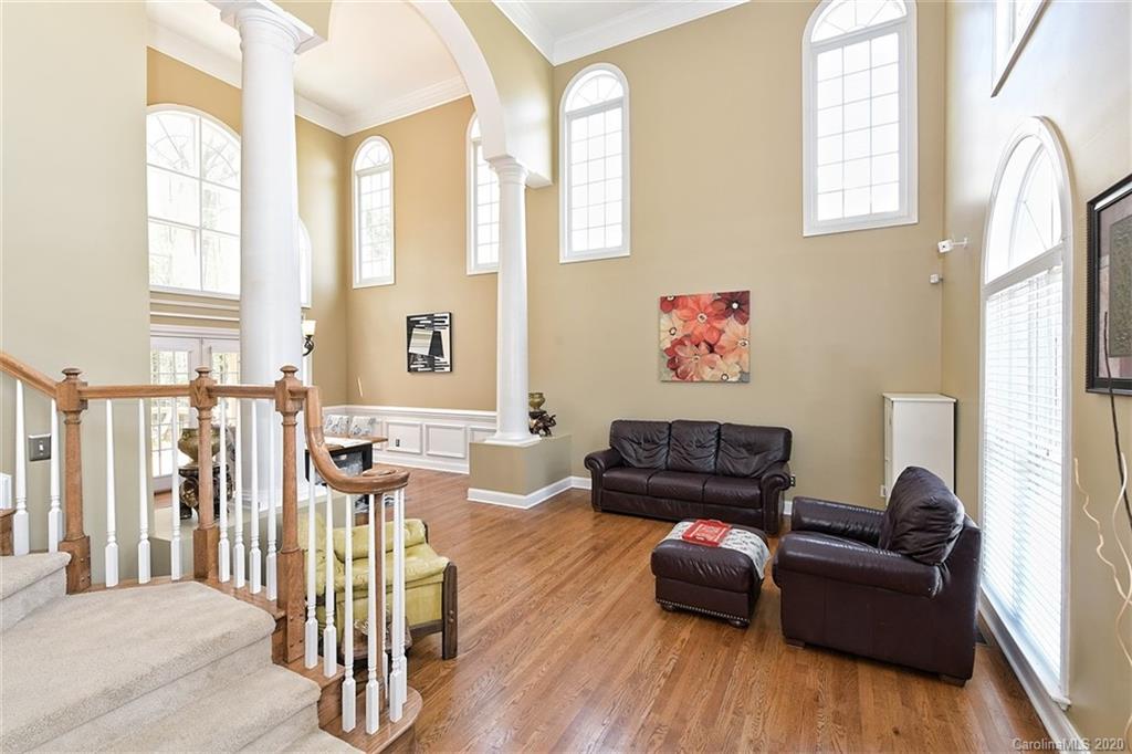 3330 Rhett Butler Place Charlotte, NC 28270 - Photo 7 of 48 a living room with furniture and wooden floor